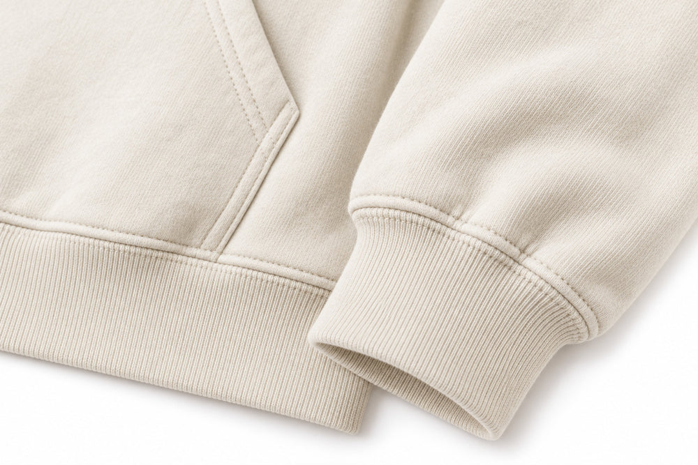 Close-up of the seam stitching of the Ocean Archive bone DTG print hoodie