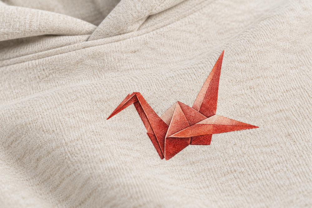 Close-up of the DTG print decoration on the Paper Crane oatmeal DTG print hoodie