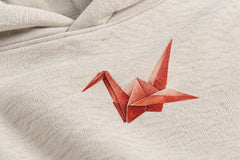 Close-up of the DTG print decoration on the Paper Crane oatmeal DTG print hoodie