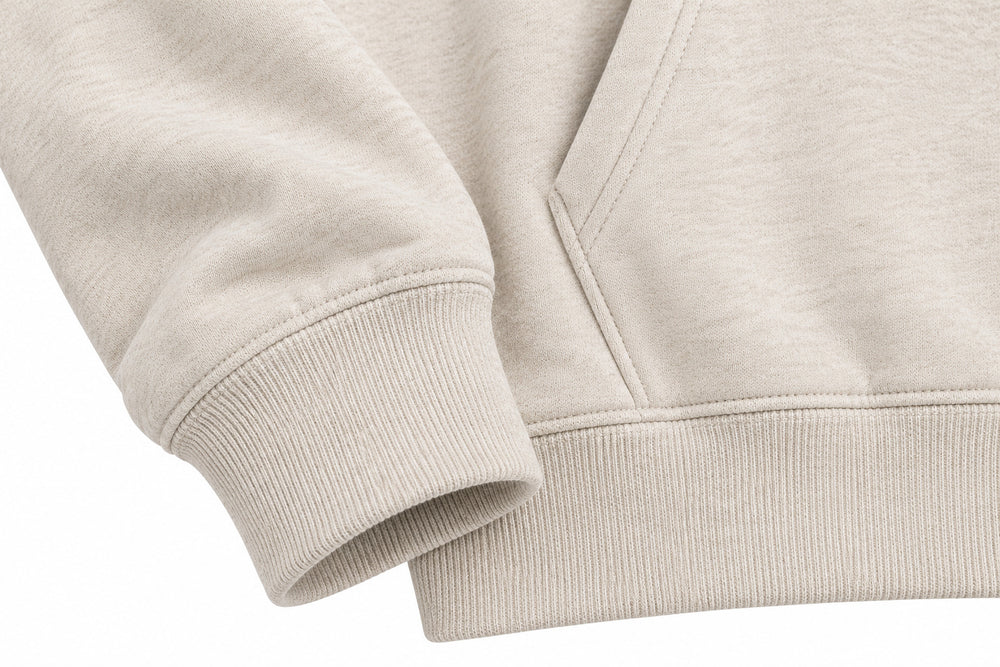 Close-up of the seam stitching of the Paper Crane oatmeal DTG print hoodie