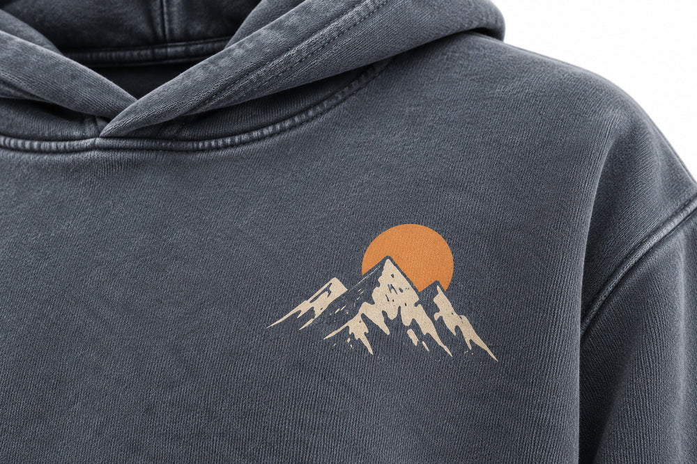 Close-up of the DTG print decoration on the Summit Dawn washed slate DTG print hoodie