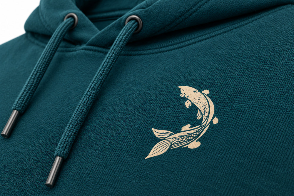 Close-up of the DTG print decoration on the Wild Current deep teal DTG print hoodie
