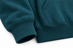 Close-up of the seam stitching of the Wild Current deep teal DTG print hoodie