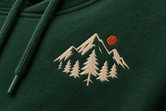 Close-up of the embroidered decoration on the Alpine Crest forest green embroidered hoodie