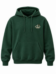 Front view of the Alpine Crest forest green embroidered hoodie with ivory-and-rust mountain crest embroidery on the left chest