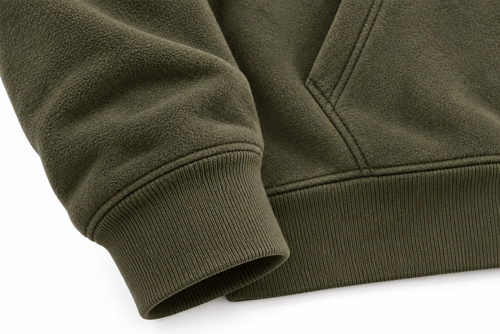 Close-up of the seam stitching of the Alpine Half Zip olive embroidered half-zip hoodie