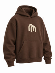 Front three-quarter view of the Arc Atelier chocolate brown embroidered boxy hoodie