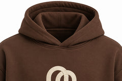 Close-up of the hood and neckline of the Arc Atelier chocolate brown embroidered boxy hoodie