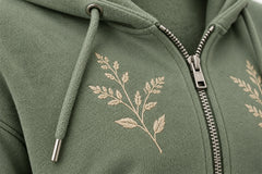Close-up of the embroidered decoration on the Botanical Zip sage embroidered cropped zip-up hoodie