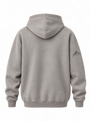 Back view of the Contour Club stone gray embroidered oversized hoodie with plain back; small matching peak on one sleeve