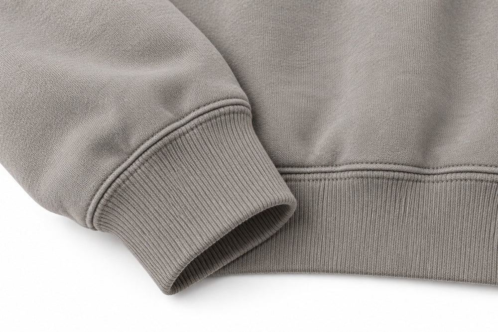 Close-up of the seam stitching of the Contour Club stone gray embroidered oversized hoodie
