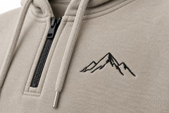 Close-up of the embroidered decoration on the Contour Half Zip stone embroidered boxy half-zip hoodie