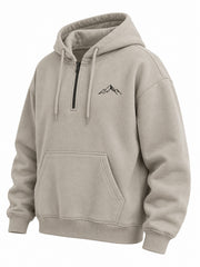 Front three-quarter view of the Contour Half Zip stone embroidered boxy half-zip hoodie