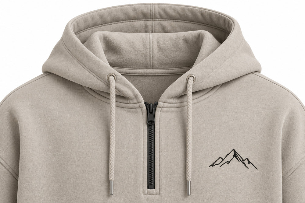 Close-up of the hood and neckline of the Contour Half Zip stone embroidered boxy half-zip hoodie