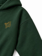 Close-up of the sleeve of the Contour Stitch forest green embroidered boxy hoodie