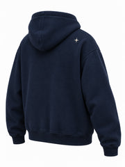 Rear three-quarter view of the Crescent Studio midnight navy embroidered boxy hoodie