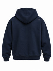 Back view of the Crescent Studio midnight navy embroidered boxy hoodie with one tiny matching star at the right shoulder