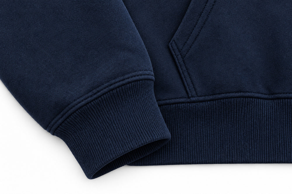 Close-up of the seam stitching of the Crescent Studio midnight navy embroidered boxy hoodie