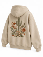 Rear three-quarter view of the Desert Bloom sand embroidered zip-up hoodie