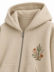 Close-up of the hood and neckline of the Desert Bloom sand embroidered zip-up hoodie
