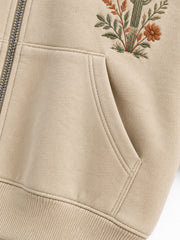 Close-up of the seam stitching of the Desert Bloom sand embroidered zip-up hoodie