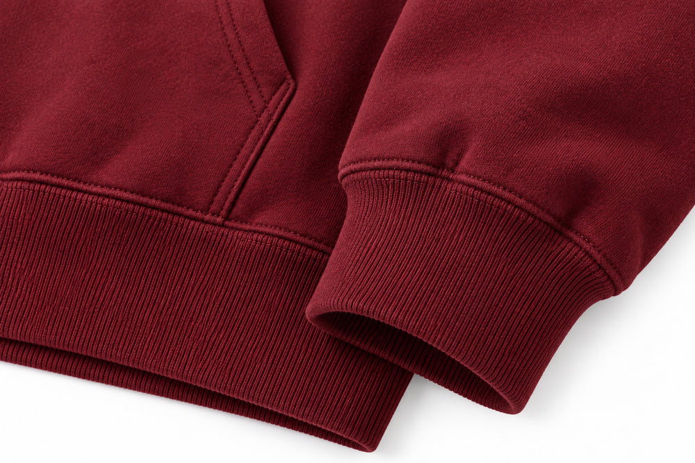 Close-up of the seam stitching of the Field Service burgundy embroidered hoodie
