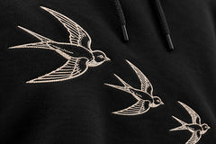 Close-up of the embroidered decoration on the Flight Line black embroidered hoodie