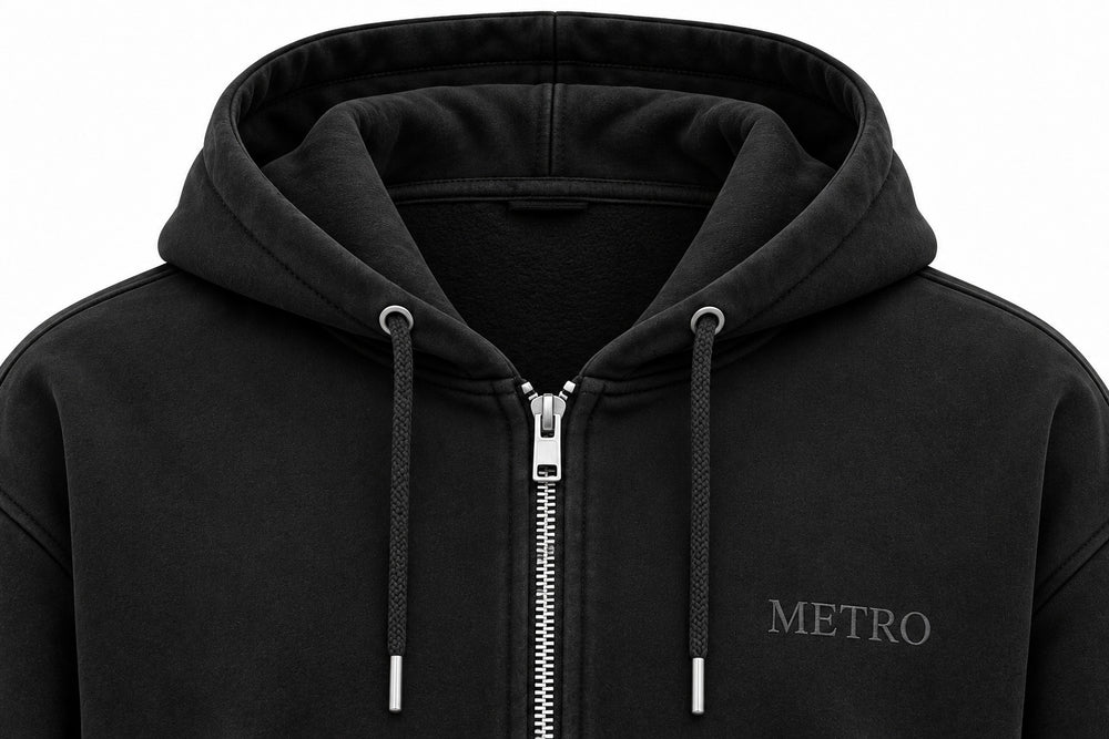 Close-up of the hood and neckline of the Metro Zip black embroidered zip-up hoodie