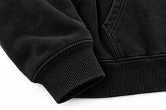 Close-up of the seam stitching of the Metro Zip black embroidered zip-up hoodie