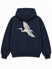 Back view of the Night Heron ink navy embroidered oversized hoodie with a large ivory heron in flight