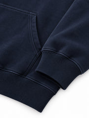 Close-up of the cuff and hem rib of the Night Heron ink navy embroidered oversized hoodie