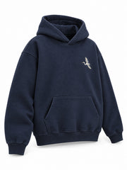 Front three-quarter view of the Night Heron ink navy embroidered oversized hoodie