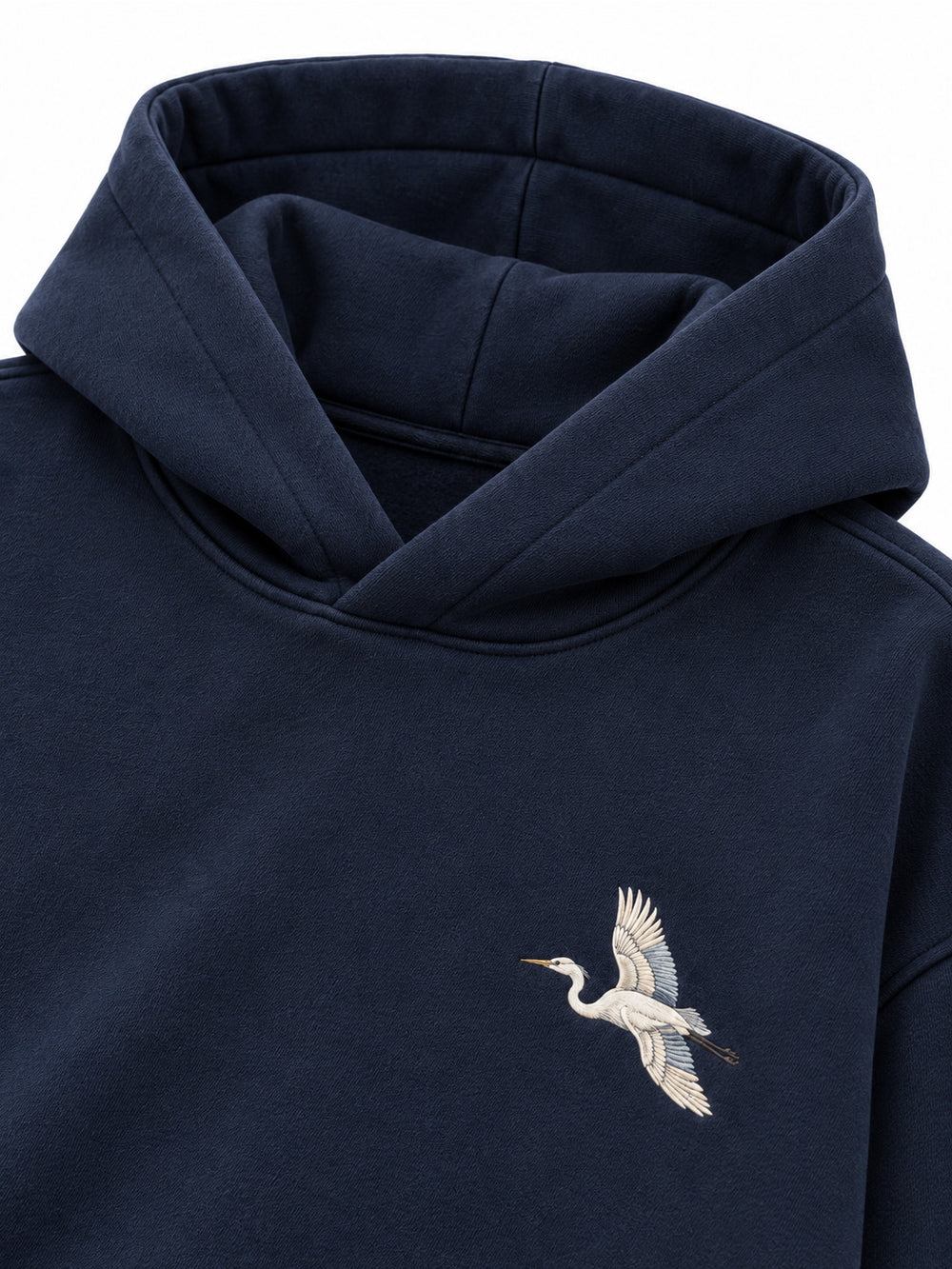 Close-up of the hood and neckline of the Night Heron ink navy embroidered oversized hoodie