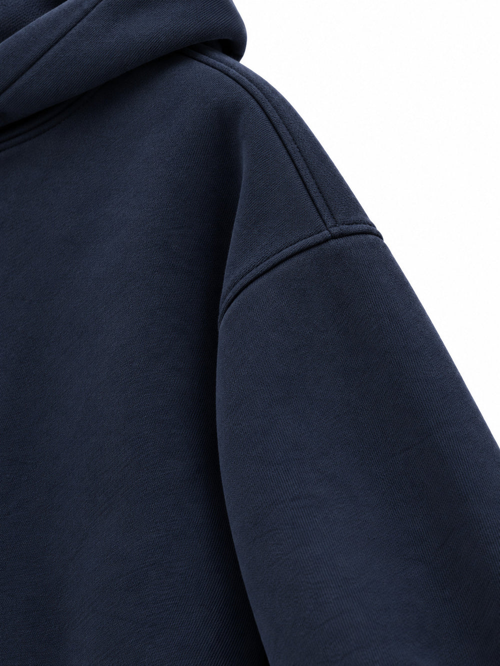 Close-up of the sleeve of the Night Heron ink navy embroidered oversized hoodie