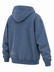 Rear three-quarter view of the Ocean Mark washed blue embroidered hoodie