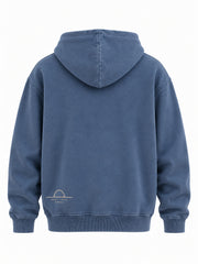 Back view of the Ocean Mark washed blue embroidered hoodie with small cream horizon embroidered low on the left side
