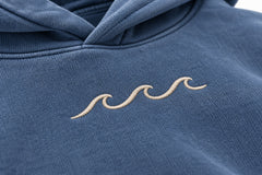 Close-up of the embroidered decoration on the Ocean Mark washed blue embroidered hoodie