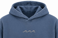 Close-up of the hood and neckline of the Ocean Mark washed blue embroidered hoodie
