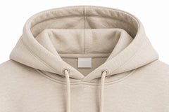 Close-up of the hood and neckline of the Quiet Form oatmeal embroidered oversized hoodie