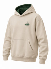 Front three-quarter view of the Trail Compass warm sand embroidered hoodie