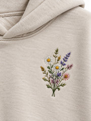 Close-up of the embroidered decoration on the Wild Meadow oatmeal embroidered hoodie
