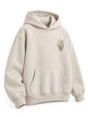 Front three-quarter view of the Wild Meadow oatmeal embroidered hoodie