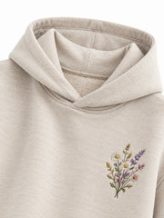 Close-up of the hood and neckline of the Wild Meadow oatmeal embroidered hoodie