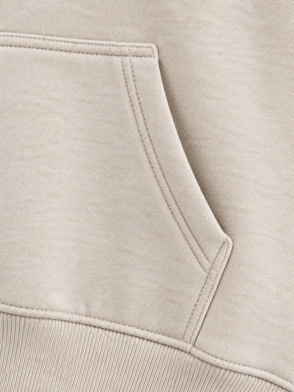 Close-up of the seam stitching of the Wild Meadow oatmeal embroidered hoodie