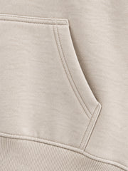Close-up of the seam stitching of the Wild Meadow oatmeal embroidered hoodie
