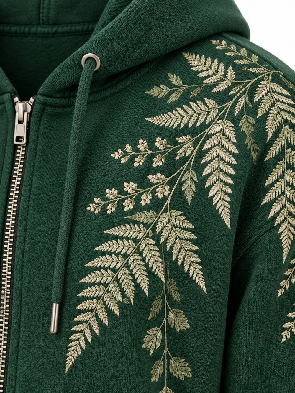 Close-up of the embroidered decoration on the Fern Spray forest green embroidered zip-up hoodie