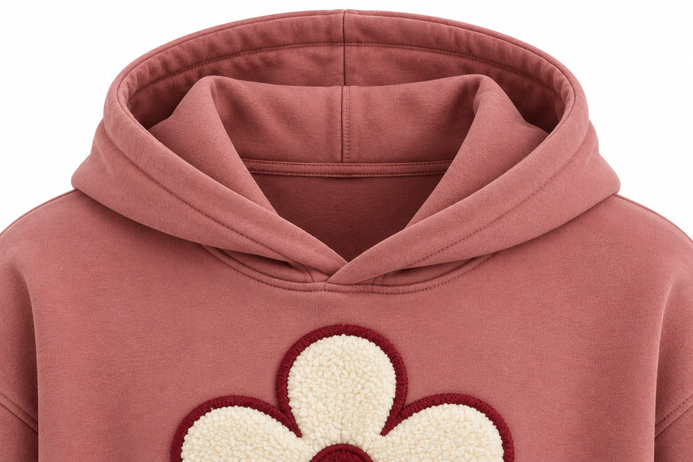 Close-up of the hood and neckline of the Felt Bloom dusty rose felt appliqué hoodie