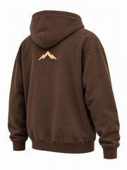 Rear three-quarter view of the Heritage Stitch brown felt appliqué hoodie
