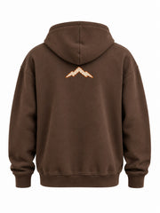 Back view of the Heritage Stitch brown felt appliqué hoodie with small cream mountain appliqué below the hood