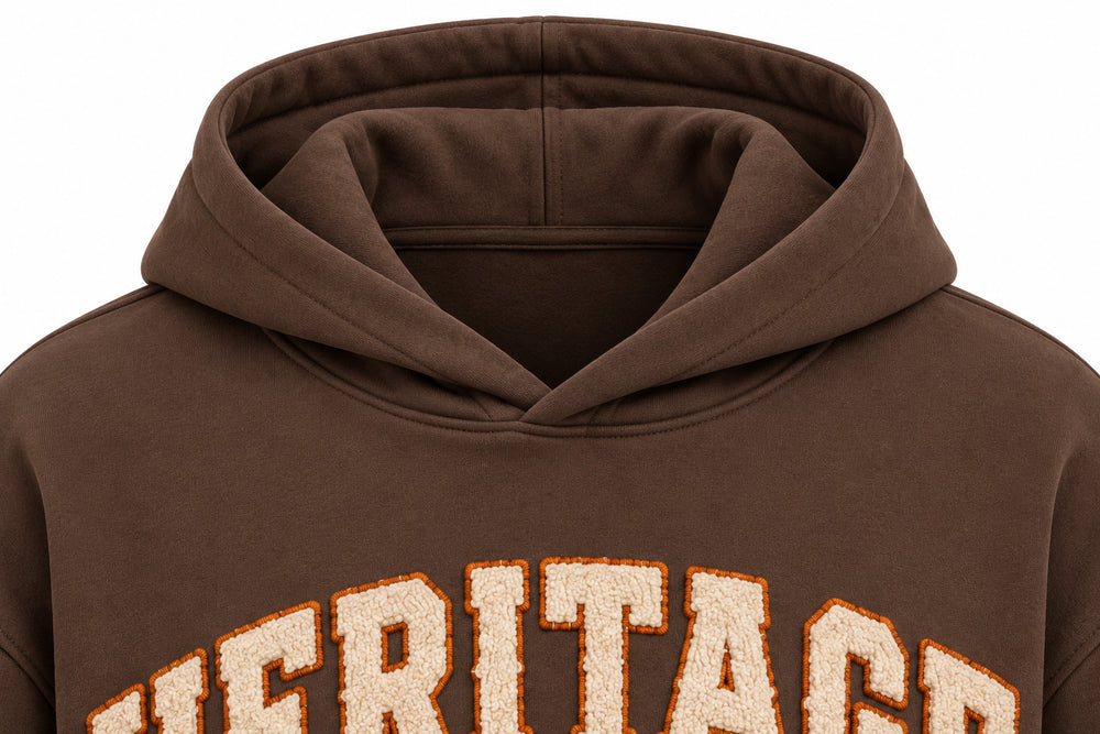 Close-up of the hood and neckline of the Heritage Stitch brown felt appliqué hoodie